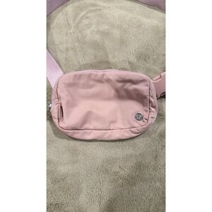 Lululemon Athletica Everywhere Belt Bag 1L in a light pink color